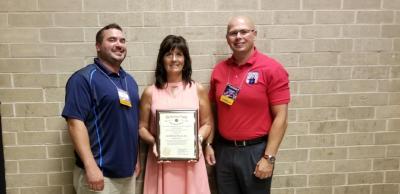Pictured right to left: Smithfield Foods representatives Randy Koch, operations manager, Michelle Reyburn, human resource manager, and Ted Karagias, corporate continuous improvement manager, accepted the 2018 Employer of the Year Award from The National Veterans Employment & Education Commission on behalf of the company.