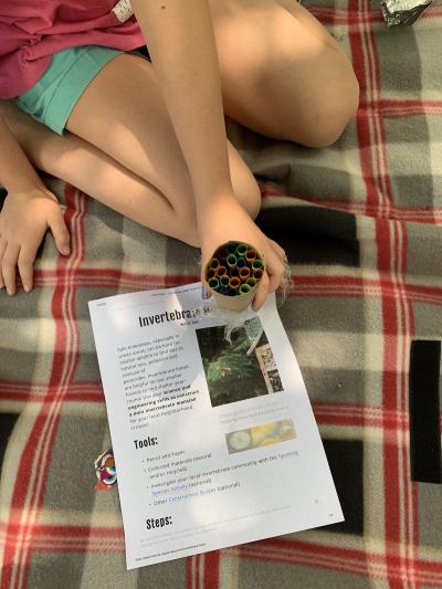 Subaru of America, in partnership with the American Association for the Advancement of Science (AAAS), creates science-based activities for families and online educational resources for educators. Pictured: Child shows insect hotel created doing the Invertebrate Hotel activity. Photo credit: Suzanne Thurston.