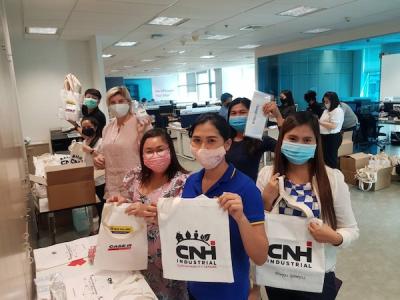 CNH Industrial employees in Thailand help prepare ‘Fight Covid-19’ packages for distribution to local communities throughout the country.