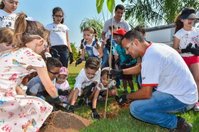 Employees and their families take part in a tree planting and biodiversity schemes at CNH Industrial facilities in Brazil. Image taken before COVID-19 social distancing regulations.