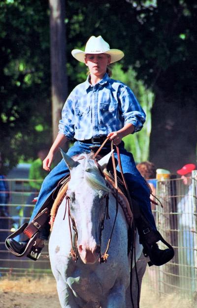 Koryne Carlson and her first show horse, Clue, at a local open show where they showed in the “Western Pleasure” category (circa. 2005).