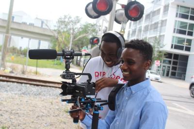 NBCUniversal’s Project Innovation awards grants to nonprofits, including Urgent Inc., an organization that helps teenagers, such as Martin Eugene (right), discover careers in creative and tech industries. Photo credits: Comcast