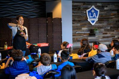 In 2019, AEG’s LA Galaxy Foundation welcomed more than 350 students from elementary schools in the greater Los Angeles area to Dignity Health Sports Park for a series of Protect the Pitch fieldtrips, which included a tour of the stadium’s sustainable operations – including its garden – as well as a cooking class.