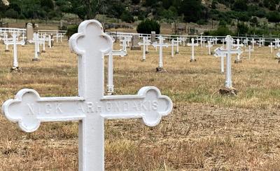 A white iron cross bearing the name of Nick Arhondakis is one of nearly 400 in Dawson Cemetery memorializing the miners killed in the 1913 and 1923 mine explosions. Nick Arhondakis was one of 263 men who died in the 1913 incident, the second-deadliest mine disaster in U.S. history. Another 120 lost their lives in 1923. (Nick Pappas/ Albuquerque Journal)