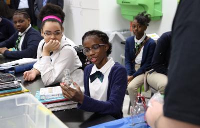 Detroit Enterprise Academy seventh-graders Schyla Ward (left) and Amore Nelson explore the science behind chemical reactions. This STEM-focused learning experience, made possible by a grant from the FCA Foundation, brings engaging and immersive education taught by Cranbrook Institute of Science instructors to 4,500 students in Detroit, Dundee, Sterling Heights and Warren, Michigan.