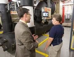 Chad Doering, director of Housing for Facilities Management, Division of Housing & Residence Education, at the University of Florida and Sheila Noel, Reitz Union maintenance specialist at the university, discuss the union’s upgraded chilled water system designed to lower environmental impact. This system is one component of the long-term commitment to sustainability for which the university was recognized with the Trane Energy Efficiency Leader Award on Aug. 29.