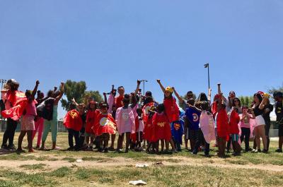 The children who attend Red Eye’s Saturday mentoring sessions pose for a group picture. Photo courtesy of Flora Huang.