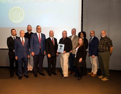 Award presentation: From left to right: Mike Smith, account manager, Trane Michigan, Ken Wilson, field leader, Trane Michigan, Ken Wojtkowiak, facilities manager, Ford Land Data Center, Donny Simmons, president, Trane Commercial HVAC North America & EMEA, Parry Hughes, VP & general manager, Trane Michigan, Dwayne Atkins, engineering manager, Ford Motor Company, Mike Hogg, sales manager, Trane Michigan, Meredith Portenga, marketing specialist, Trane Michigan, Rochelle Hill, project manager, Trane Michigan, Sam Parise, general manager, controls & system integration, Trane Michigan, Jeff White, energy efficiency and supply manager, Ford Motor Company