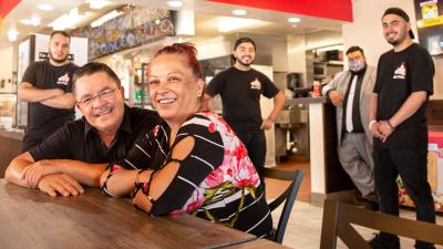 Efrain Mejorada Sr., Susana Yanez, and their sons (from left), Hermes Mejorada, Emmanuel, and Efrain Jr., lead Los 3 Pollos restaurant group with help from Wells Fargo Senior Business Banking Specialist Mario Murillo (in back). Photo: Jim Krantz