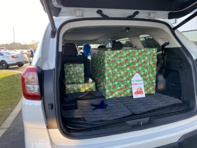 A convoy of Subaru vehicles, led by Camden County Police Department, delivered shopping spree wish items outside eight-year-old Camden boy’s home on December 11, 2020. The online shopping spree was granted thanks to support from Subaru through the annual Subaru Share the Love Event. Photo credit: Make-A-Wish