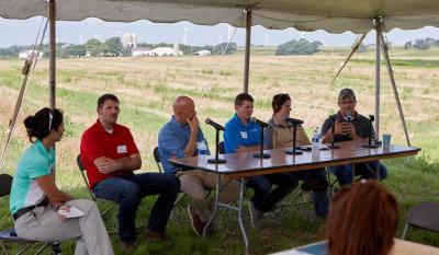 Marguerite Tan, senior staff engineer at Hormel Foods, moderates a panel discussion for farmers on how to increase agricultural productivity and profit while also protecting and improving local water resources.