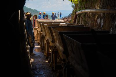 Carts of mineral ore are hauled out of a mine run by Rutongo Mines Ltd., north of Kigali, Rwanda. A team from Intel's Responsible Minerals Program, as well as representatives of other tech firms, visited mineral-rich Rwanda in November 2019 as part of an industry effort to ensure a legal and ethical supply chain. Tin, tanatalum, tungsten and gold mined in the Central African country are key components of silicon chips that run today's smartphones, laptops, servers and other high-tech gear. (Credit: Walden Kirsch/Intel Corporation)