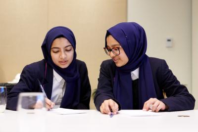 Students from Eden Girl’s School in London participate in confidence-building exercises during a Career Day that took place on International Women’s Day