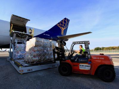 JetBlue and Atlas Air crewmembers load a 747 aircraft with more than 110 tons of supplies to assist in recovery efforts in Puerto Rico.