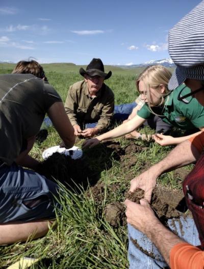 Kate Indreland and her dad, Roger Indreland, conduct a visual soil assessment (VSA) during a soil workshop held at their family ranch. The VSA is a baseline test to compare soils side by side.