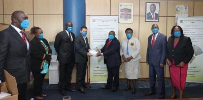 Public safety workers in Nairobi are among the first recipients of the new USA Marafiki masks. Here, Bechtel’s Muthoni Koinange (second from left), Thomas Yongo (third from left), and U.S. Ambassador Kyle McCarter (fourth from left) deliver supplies to the country’s National Police Service Commission leaders, including CEO Joseph Onyango (first from left), Chair Eliud Kinuthia (fifth from left), Deputy Chair Dr. Alice Otwala (sixth from left), Commissioner John Ole Moyaki(seventh from left), and Commissioner Lillian Kiamba (eighth from left)