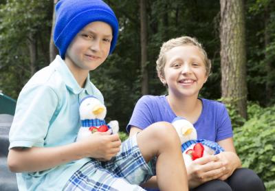Brayden, 8, and Mackenzie, 14, patients at the Aflac Cancer and Blood Disorders Center in Atlanta, pose with the 2017 Aflac Holiday Duck, which is now on sale at participating Macy's and at Aflac.com/HolidayDuck. All net proceeds go to the treatment and research of childhood cancer. -- Image from Aflac