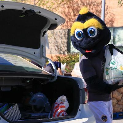 LA Galaxy's Cozmo helps distribute groceries to 350 vulnerable students during LA Harbor College's Spring Food Distribution event