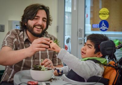 Horticultural Therapist Rich Matteo works with Overbrook School of the Blind student Lingsen Kong.