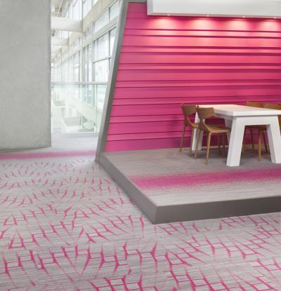 Bold pink hues create striking patterns in Mohawk Group's Street Thread carpet tile, one of the eligible collections in the Specify for a Cure program. Photography courtesy of Mohawk Group.