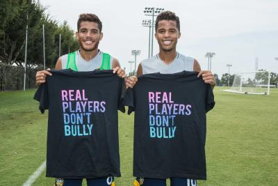 LA Galaxy players Giovani dos Santos and Jonathan dos Santos participate in the Playworks campaign, Real Players Don’t Bully, by sporting shirts with the campaign slogan to raise awareness about National Bullying Prevention Month.