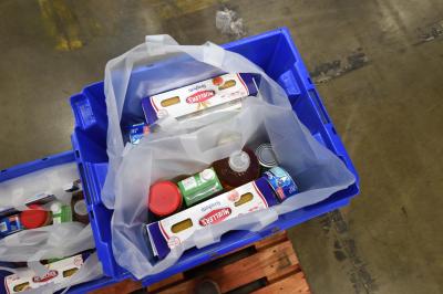 Two food kits prepared by AEG employees just off the assembly line to be distributed to seniors in the greater Los Angeles area feature items including peanut better, pasta, canned goods, etc. AEG employees prepare more than 1,400 food kits at the Los Angeles Regional Food Bank in Commerce, Calif. on Aug. 29, 2017.