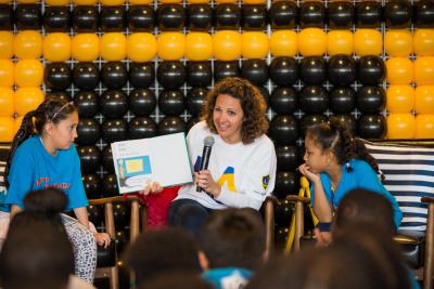 Dignity Health Sports Park General Manager Katie Pandolfo reads to elementary students during the Read Across America Celebration at Dignity Health Sports Park on February 28, 2019.