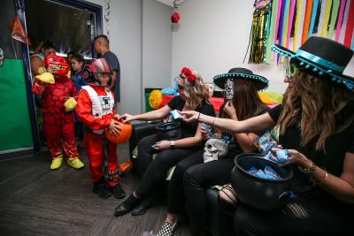 Children and families trick-or-treat in costume throughout the suites at StubHub Center in Carson, Calif. for the 11th annual Treats-n-Suites Halloween Bash on October 20, 2017.