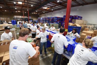 AEG employees prepare more than 1,400 food kits to be distributed to seniors in the greater Los Angeles area on an assembly line at the Los Angeles Regional Food Bank in Commerce, Calif. on Aug. 29, 2017.