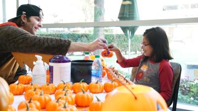 LA Kings goalie Jack Campbell decorates pumpkins with patients and families at Children’s Hospital Los Angeles during the club’s annual team (Halloween-themed) visit on October 29, 2019.
