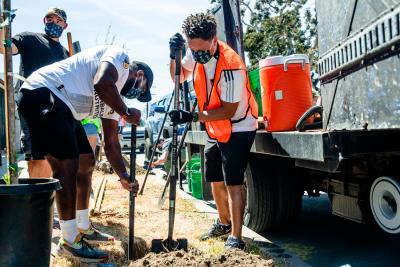 LA Galaxy and MLS star Cobi Jones works alongside LA Galaxy staff and supporters to plant trees in a Watts neighborhood in Los Angeles in conjunction with TreePeople for Earth Month on April 29, 2021.