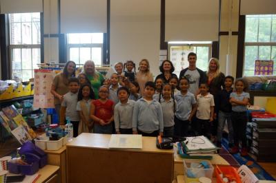 Timberland employee volunteers enjoy meeting their first grade reading students during an end-of-year celebration. The volunteers had ten weekly online tutoring sessions with their students through TutorMate’s interactive platform.