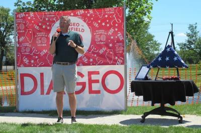 Representative Randy Hultgren presented Diageo Plainfield with a flag that has flown over the United States Capitol in honor of the facility's 50th anniversary. The flag will now fly over the Diageo Plainfield plant. (Photo: Diageo.)