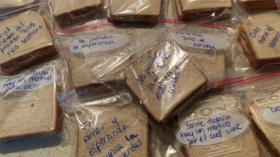 On each sandwich, messages like “Don’t give up” and “Smile, there are still reasons to live” offer a moment of hope.