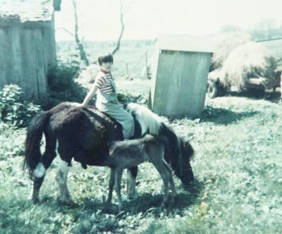 Ramona riding her pet horse, Floosy, with her colt named Broccoli.
