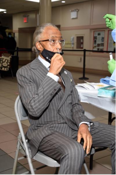 Rev. Al Sharpton, co-chair of the Choose Healthy Life National Black Clergy Health Leadership Council, demonstrates the ease and necessity of COVID-19 testing to help address the disproportionate impacts of COVID-19 in Black communities. This event, held at the Abyssinian Baptist Church in Harlem on Jan. 25, is the first of hundreds of planned COVID-19 testing events at Black churches across the US, a partnership of Choose Healthy Life, Quest Diagnostics, and the United Way.