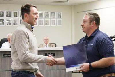 Freeport-McMoRan Strategic Community Development Manager Sean Wenham presents a $50,000 grant check to Safford Downtown Association board president Danny Smith. Photo from David Sowders/Eastern Arizona Courier.