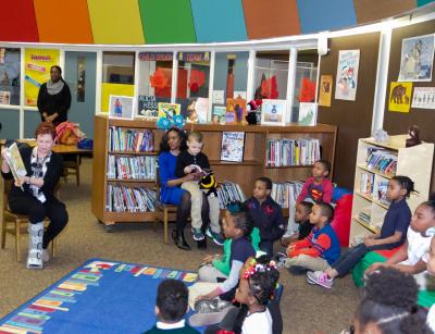 Sandy Capell, Manager of Corporate Responsibility and Philanthropy, Subaru of America, Inc. (left), reads Dr. Seuss’ Oh The Places You’ll Go to Forest Hill Elementary School students during ribbon cutting celebration for new reading oasis on March 5, 2019. Installed in partnership with United Way of Greater Philadelphia and Southern New Jersey and the Camden City School District, the reading oasis provides the school with 400+ new books in an inviting, comfortable space for students to enjoy.