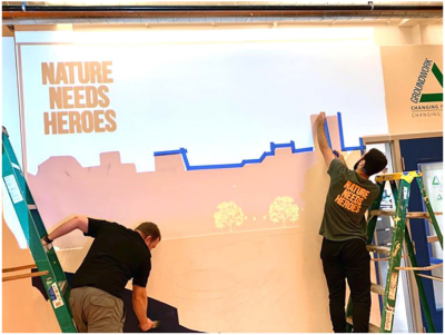 Timberland volunteers paint a mural to celebrate Serv-a-palooza, one of the brand’s two global annual days of service. Over 275 volunteers served at nine different project sites in Lawrence, MA.