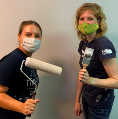Timberland employees paint a vacant apartment at New Generation, a local shelter for pregnant and parenting women who are homeless as part of the company’s 23rd annual Serv-a-palooza event A mom and her two children moved in shortly after the apartment was complete.