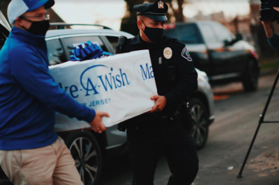 Eight-year-old Antonio, who battles a critical, life-threatening illness, was on the receiving end of a Subaru convoy delivering shopping spree wish items in Camden, NJ. Photo credit: Make-A-Wish