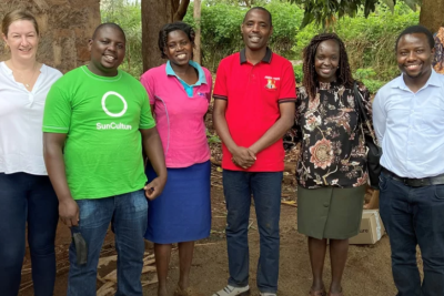 Caption: Stella Tai meeting with representatives from SunCulture, an organization connecting rural farmers with solar power.