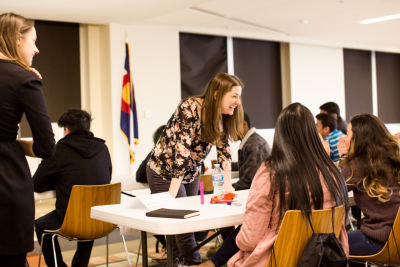 Octavia Carifi-Ansley, a recruiter at T. Rowe Price, facilitates a resume writing and interview skills workshop for students from Atlas Preparatory School in Colorado Springs