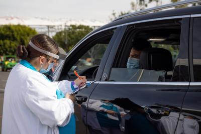 Healthcare workers register vulnerable and underserved populations in Los Angeles for Covid-19 vaccines at Dignity Health Sports Park
