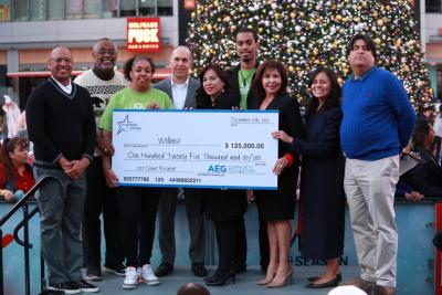 The AEG Community Foundation awards one of its first macro grants to Wellnest in Los Angeles during AEG's annual Community Holiday Party at L.A. LIVE on December 17, 2019.