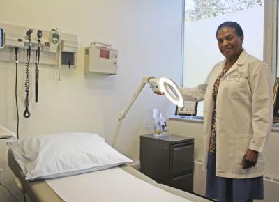 Cynthia Small, a nurse practitioner at Whirlpool Corp., demonstrates what her equipment does Monday at the company's global headquarters. Photos by Tony Wittkowski
