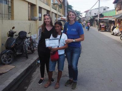 WPF’s Claire Kelly presents MS. Nolibeth Ybanez PaCaldo with her award, along with staff from entrepreneurs DU Monde.