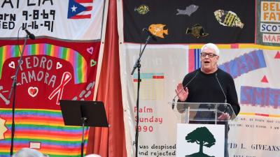 Main Photo: Cleve Jones speaks at a 2019 World AIDS Day ceremony held at the National AIDS Memorial in Golden Gate Park to welcome panels of the AIDS Memorial Quilt back home to San Francisco. (Credit: National AIDS Memorial/Trish Tunney)