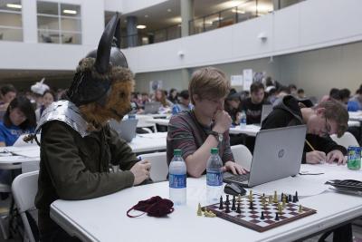 Jordan DeShan won the CodeWars costume contest with a mashup of past Halloween costumes, including a bear mask, Viking hat and shoulder armor made from aluminum cans. Credit Alison Hess