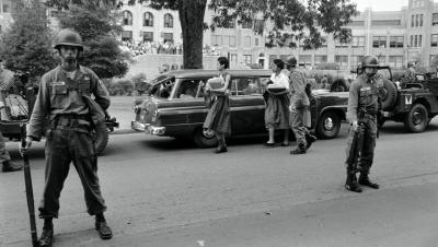 The Arkansas National Guard escorts Carlotta Walls LaNier and a fellow member of the Little Rock Nine on the grounds of Little Rock Central High School, September 1957. (Ed Clark/The LIFE Picture Collection via Getty Images)